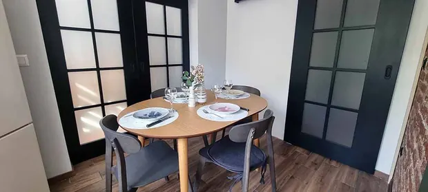Dining area with black doors
