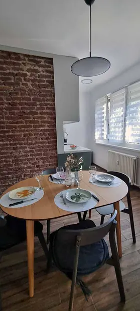 Dining table and brick wall