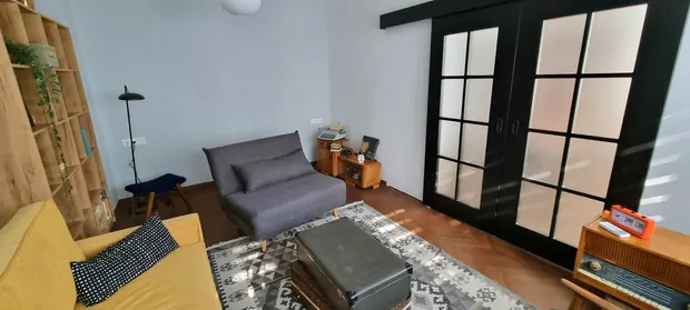 Living room with black sliding doors