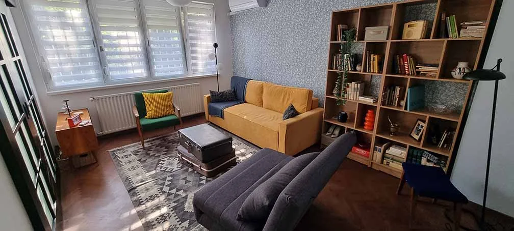 Living room with yellow sofa and vintage details